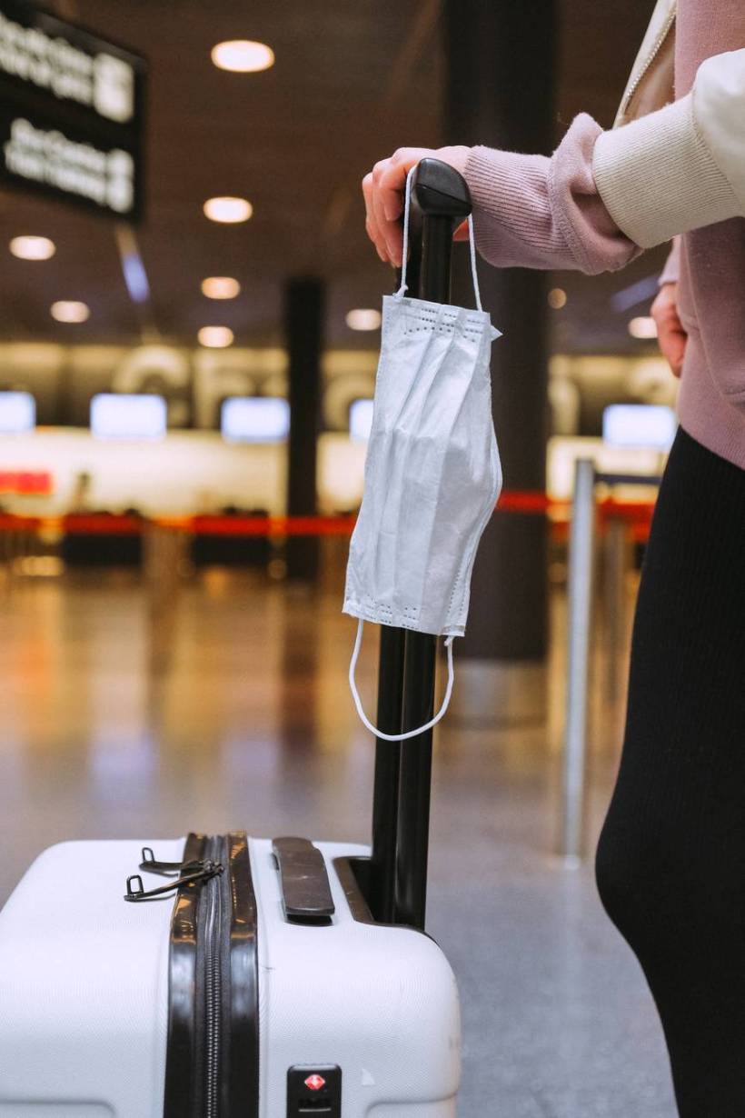 face mask on luggage